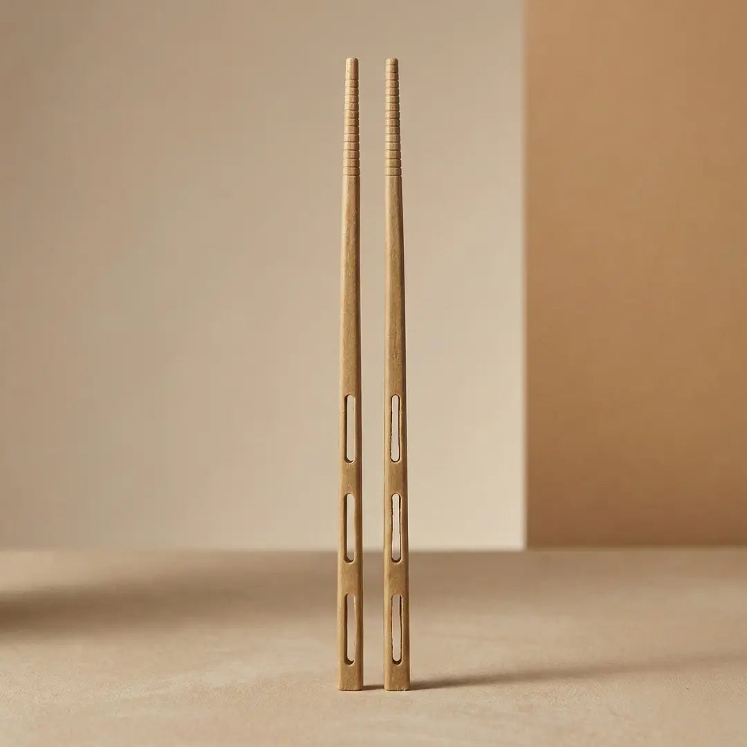 CompostEase compostable chopsticks made from molded plant fiber with squared profile, grip texture, and cutout slots on a neutral background.