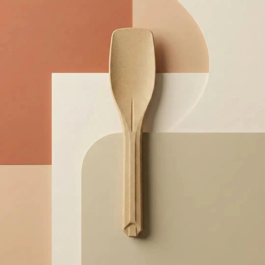 CompostEase ice-cream scoop made from molded plant fiber shown on a modern neutral color background
